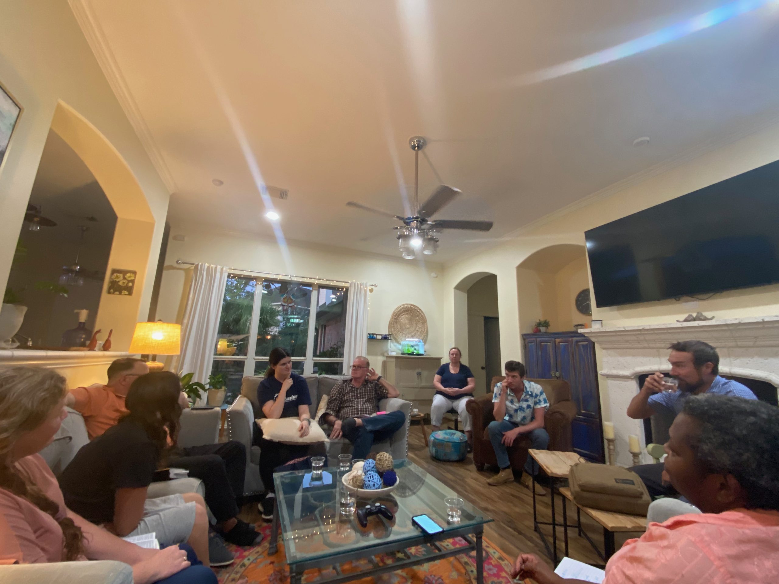 Students and teachers gathered for Bible teaching and fellowship in a home